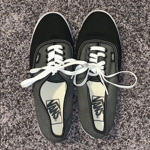 Black and grey Vans sneakers